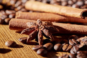 Aroma coffee chocolate cookies and spices on the wooden table. Dark wooden background. Top view. Close. Closeup.