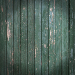 old wooden striped background with shabby green paint