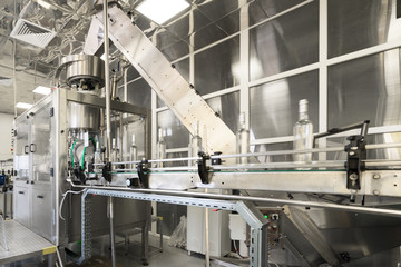 Distillery. Line for filling and capping bottles.