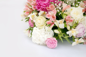 Flower arrangement with pink and white roses, wedding day, outdoors.