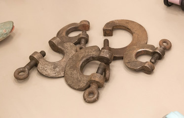 Collection of rusty metal clamps