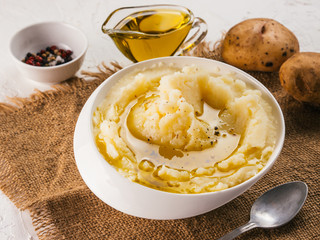 Mashed potatoes on white concrete background