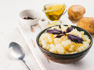 Mashed potatoes on white concrete background