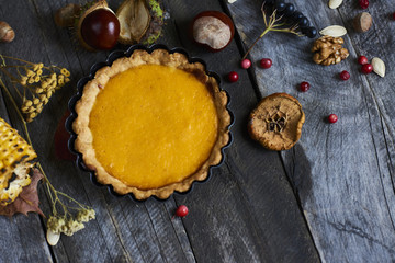 Obraz na płótnie Canvas Homemade Pumpkin Pie for Thanksgiving Ready to Eat