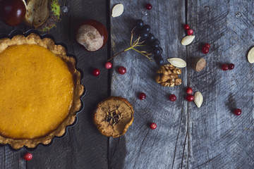 Obraz na płótnie Canvas Homemade Pumpkin Pie for Thanksgiving Ready to Eat. Top view