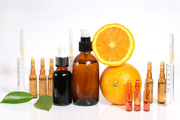 Vitamin C and Mesotherapy. Serum with vitamin C in ampoules, syringes and brown glass bottles,...