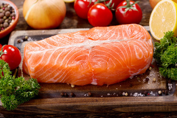 fresh salmon fillet with ingredients for cooking