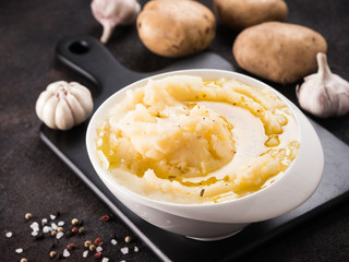 Mashed potatoes on dark concrete background