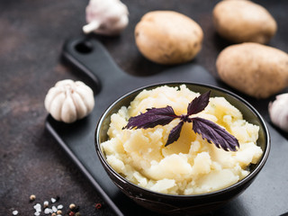 Mashed potatoes on dark concrete background