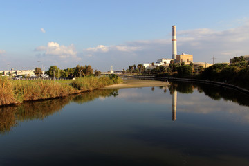 Fototapeta na wymiar View of the Yarkon river, Reading Power Station, from Bridge in Tel-Aviv, Israel.