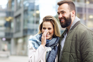 Fototapeta premium Young couple hugging in the city