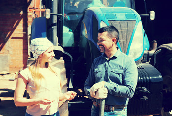 Two farmers near field engine