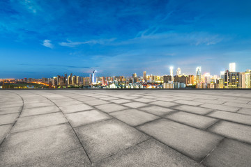 empty floor with cityscape of hangzhou in blue cloud sky at twilight