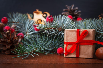 Christmas gift and green branch decoration
