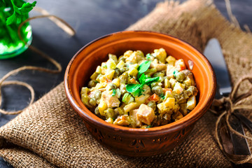 Russian salad in a bowl on the table