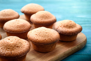 Fresh muffins on a blue wooden table. Copy space. Top Views
