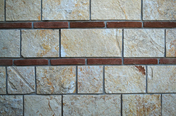 Decorated bricks wall on monastery, close up