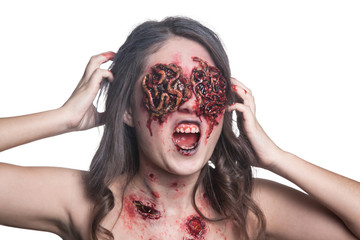 Girl with realistic sores and worms in her eyes. Creative halloween makeup. Isolated.