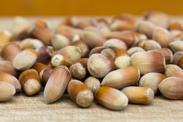 Hazelnut. Fresh organic filbert. Nuts on wooden background.