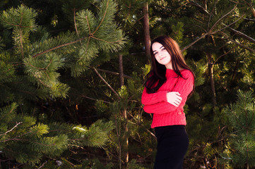 Naklejka premium Beautiful young girl in a white winter forest
