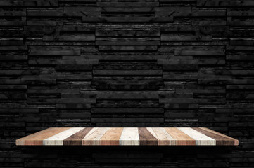 Empty wood plank shelf at black layer marble tile wall background,Mock up for display or montage of...