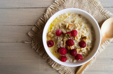 Breakfast with oatmeal and fresh raspberries.