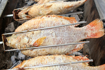 Thai Salt Crusted Grilled Fish /Salt baked fish on street food Thailand