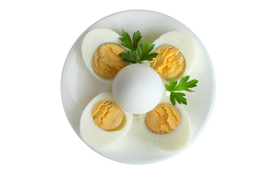 Boiled egg in a cut on a plate