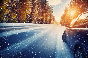 car on winter road in the morning