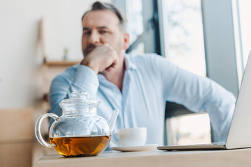 teapot and cup on table