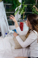 beautiful girl with drawing tools