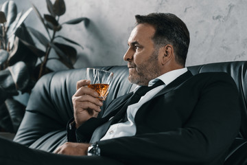 businessman with glass of whiskey