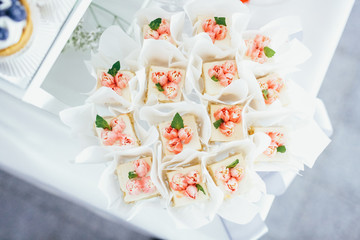 Pink desserts with tiny peonies and mint