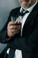 businessman with glass of whiskey