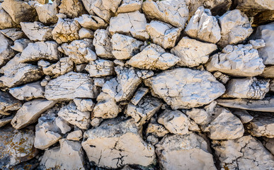 Stone rock fence or gabion wall texture.