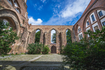Fototapeta premium Courtyard of old church of St Sephan in Gartz, Brandenburg region in Germany