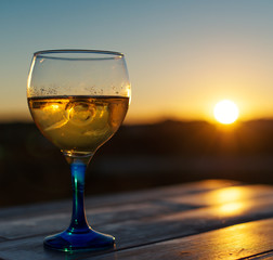 Cooled white wine on the sunset.