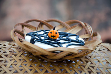 Small pumpkin in a cobweb