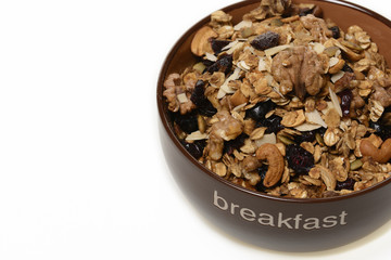 Breakfast: Bowl of whole grain muesli isolated on white background