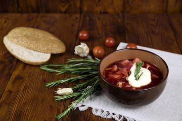 Vegetable soup with beets, rustic style, selective focus