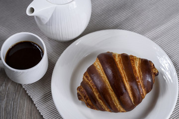 French breakfast with croissant and coffee