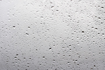 Autumn Background with raindrops on glass. Rainy weather.