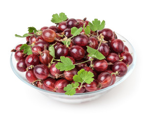Red gooseberries with green leaves isolated on white background