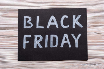 Black Friday tag on wooden background