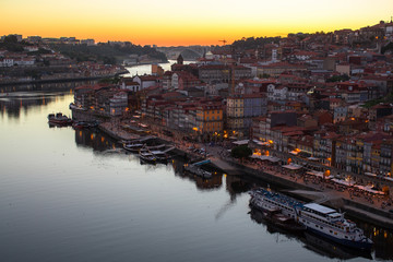 Douro river and Ribeira from Dom Luis I bridge in twilight, Porto, Portugal.