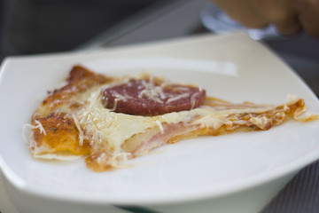 Delicious pizza on table in cafe