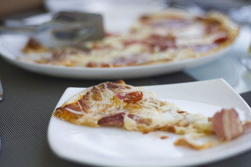 Delicious pizza on table in cafe