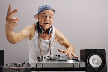 Elderly DJ making a peace sign
