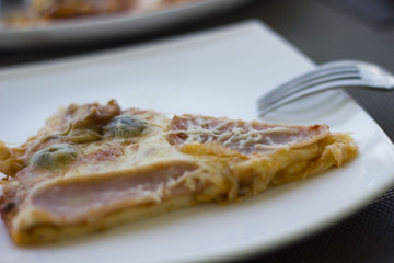 Delicious pizza on table in cafe
