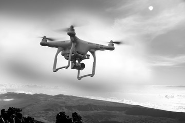 Fototapeta premium Drone, Unmanned copter flight, over the mountains, black and white photography
